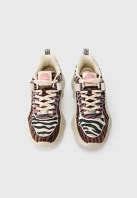 Chunky sneakers with a mixed animal print featuring zebra and tiger patterns. Cream accents and pink branding detail on the tongue.