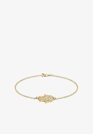 Bracelet délicat en chaîne dorée avec un pendentif central main de Hamsa orné de petites pierres précieuses transparentes et une fermeture mousqueton.