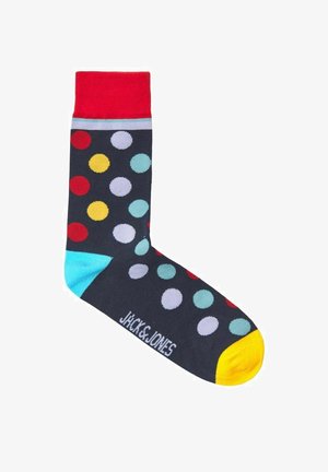 Calzini multicolori con una base blu navy, adornati da grandi pois rossi, gialli e azzurri. Cuffia rossa, tallone turchese e punta gialla.