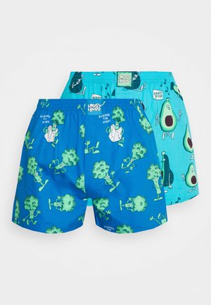Boxerset aus lebhaft blauen Stoff mit verspielten grünen Grafiken von Brokkoli und Avocado. Elastischer Bund für den Komfort.