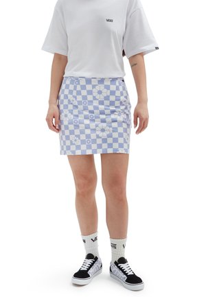 Light blue checkered mini skirt with flower patterns, paired with a white t-shirt and black sneakers, showcasing a casual style.