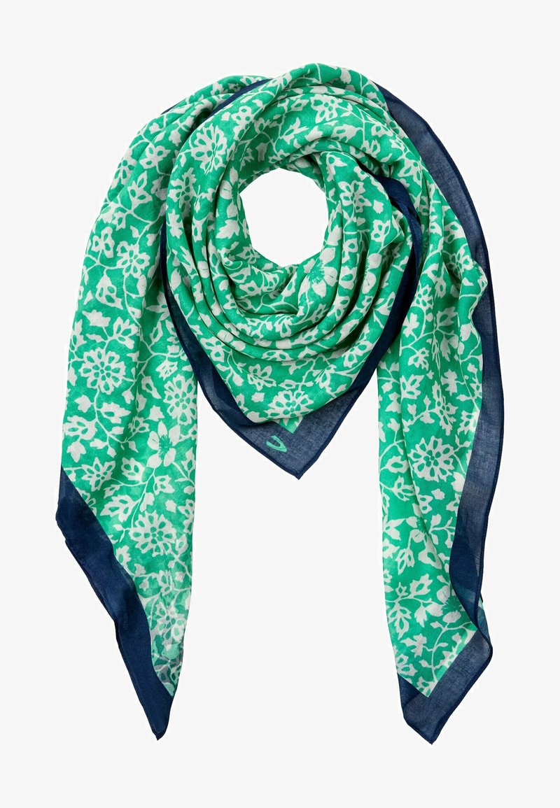 Zielony szalik w kwiatowy wzór z białymi kwiatami i granatowymi brzegami. Wykonany z lekkiego materiału, charakteryzującego się miękką teksturą i zwisającym krojem.