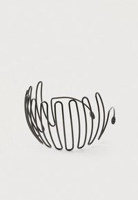 Black metal hair comb with evenly spaced, curved prongs arranged in a semi-circle on a white background.
