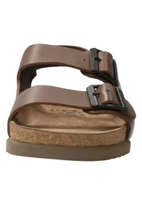 Sandales en cuir marron avec deux sangles ajustables, semelle en liège et semelle extérieure en caoutchouc. Dotées de boucles en métal pour un ajustement parfait.