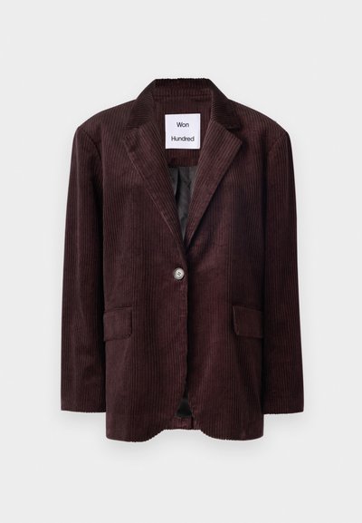 Tmavohnedý kordový blazer s klasikou golierom, s jedným gombíkom na zapínanie a dvoma prednými vreckami. Štruktúrovaná látka s vertikálnym ryhovaním.