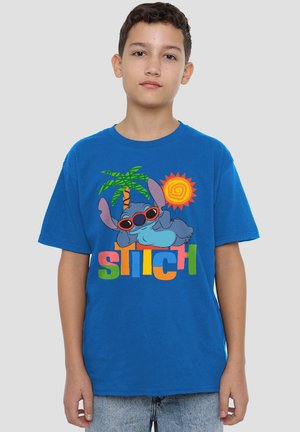Blue cotton t-shirt featuring a graphic of Stitch, a palm tree, and a sun. The text "Stitch" is multicolored, with a relaxed fit.