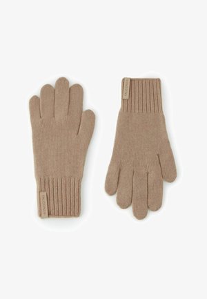 Beige knit gloves with ribbed cuffs, featuring five finger compartments and a label stitched on the cuff. Soft texture and simple design.