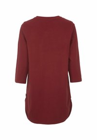 Burgundy pitkähihaine tunika. Omistaa pyöreän kaula-aukon, sivupitsit ja sileän puuvillakankaan. Takakatsaus näyttää suoran siluetin.