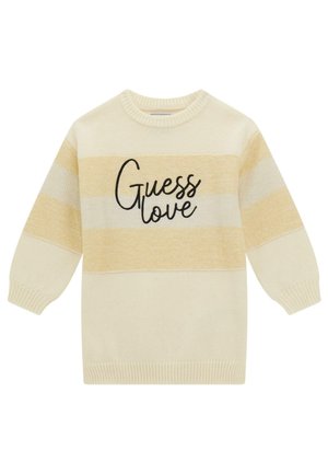 Maglione color crema con strisce gialle e avorio. Presenta un collo rotondo e la scritta "Guess love" in corsivo nero sul davanti.