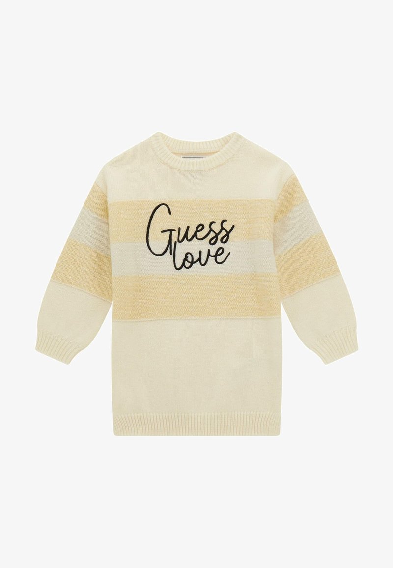 Maglione color crema con strisce gialle e avorio. Presenta un collo rotondo e la scritta "Guess love" in corsivo nero sul davanti.