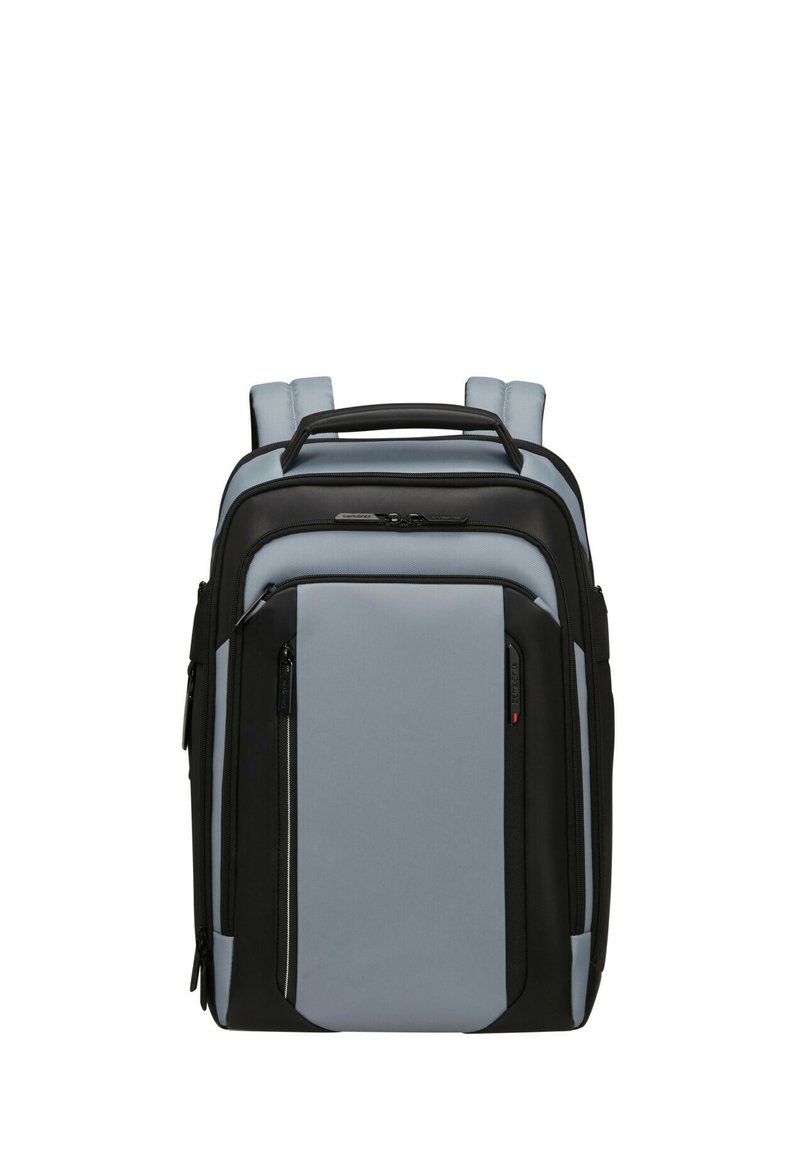 Zaino in tessuto nero e grigio chiaro con spallacci imbottiti, multipli compartimenti con zip e una maniglia superiore per il trasporto.