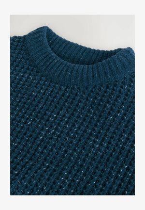 Pulover iz pletene tkanine v temno zeleni barvi z teksturiranim vafljastim vzorcem in rebrastim ovratnikom. Mehak material s subtilnimi pikami svetlejše barve.