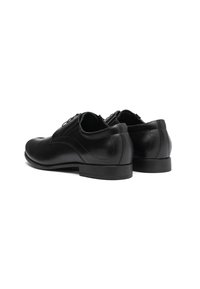 Scarpe da uomo in pelle nera con un design elegante, punta arrotondata e superficie liscia. Presentano un tacco basso e una sottile cucitura decorativa.