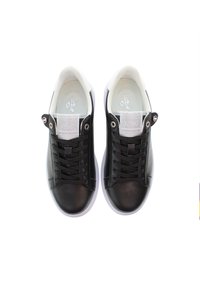 Black leather sneakers with white soles, featuring a rounded toe, lace-up front, and a textured tongue detail.