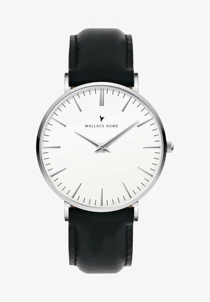 Montre ronde avec un cadran blanc, marqueurs d'heure en argent et bracelet en cuir noir. Elle présente un design minimaliste et un boîtier en acier inoxydable.