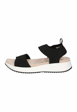 Sandali neri in maglia con due ampie cinghie, soletta imbottita e suola piatta bianca con suola nera rigata.