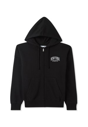 Felpa nera con zip realizzata in cotone, dotata di cappuccio, tasche frontali e un logo ricamato "New York Athletics" sul petto.