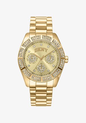 Gouden DKNY polshorloge met kristalaccenten op de lunette en wijzerplaat, voorzien van drie subwijzerplaten voor dag, datum en 24-uurs tijd.