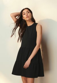 Next SLEEVLESS REGULAR FIT - Trikoomekko - black