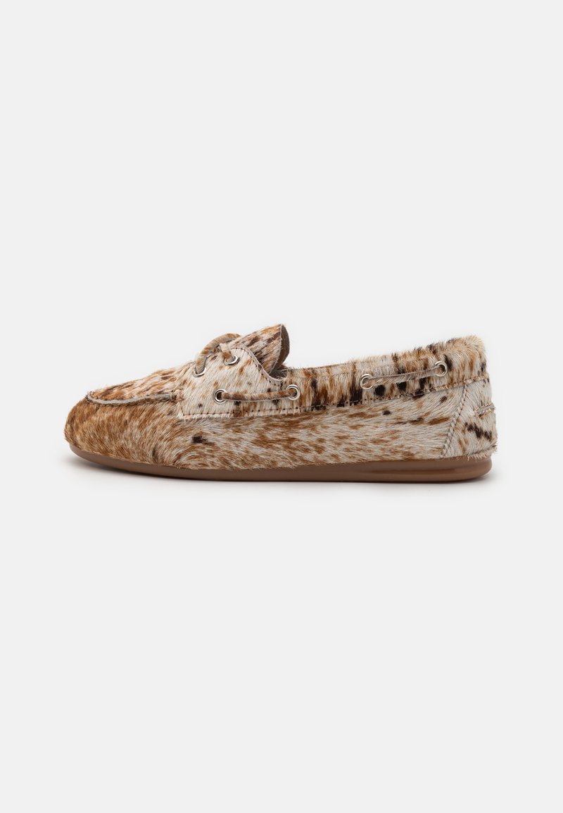 Brown and cream patterned loafers with a soft fur texture, featuring round lace-up eyelets and a flexible brown rubber sole.