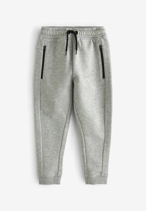 Helle graue Sweatpants aus weichem Material. Die Features umfassen einen elastischen Bund, einen Kordelzug und zwei mit Reißverschluss versehenen Seitentaschen.