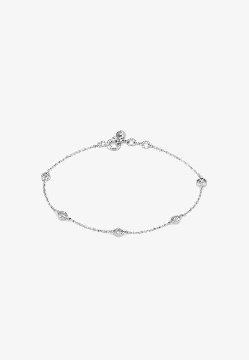 Bracelet fin en chaîne argentée avec de petits accents ronds en cristal espacés de manière uniforme et un fermoir anneau ressort avec des maillons réglables.