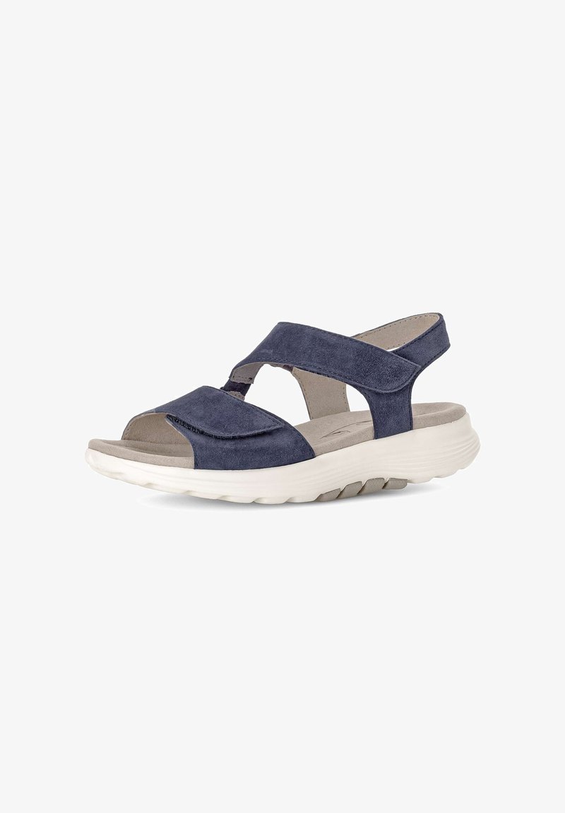 Dunkelblaue Wildleder-Sandale mit verstellbarem Riemen, gepolstertem beigem Fußbett und dicker weißer Sohle, entworfen für Komfort und lässiges Tragen.