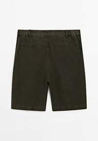 Dark green linen shorts with a waistband, back pockets, and a flat front. The fabric has a textured finish, suitable for warm weather.