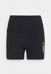 Pantalones cortos deportivos negros con una cinturilla alta, fabricados con un material suave. Incluyen un bolsillo lateral y el logo "TERREX" impreso en blanco.