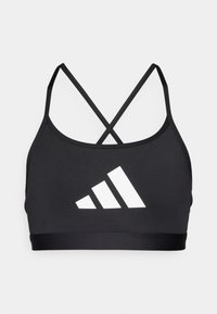 Svart sports-BH med tynne krysset stropper, laget av elastisk materiale; har et fremtredende hvitt Adidas-logo på fronten.