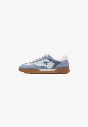 Light blue and white sneaker with a textured upper, suede accents, and a rubber sole featuring a ridged pattern; lace-up design.