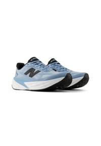 Pair of light blue New Balance running shoes with black logos, white midsoles, and black outsoles shown from front-right angle.