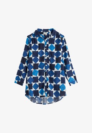Long-sleeve button-up shirt with large blue and navy square pattern on white background, collar, and cuffed sleeves.