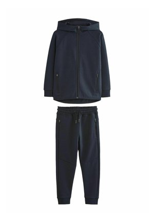 Marinblå huvjacka med framdragkedja och sidofickor, kombinerad med matchande joggarbyxor med elastisk midja och smala ben.