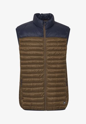 Ruskea puffervest, jossa on vetoketju etuosa, korkea kaulus ja laivaston siniset olkapäät. Siinä on vaakasuora vetoketju ja sivutaskut, joissa on vetoketjut.