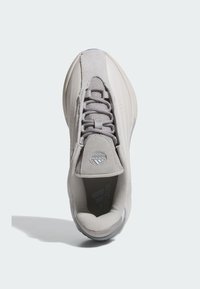 Light grey athletic shoe with mesh and suede materials. Features a round toe, textured tongue, and logo on the side. Laced up design.