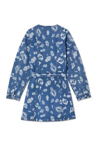 Denimkjole med lange ermer, trykt med hvite mønstre som inkluderer ansikter og blomsterdesign. Har belte i livet og knapper på mansjettene.