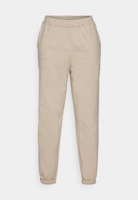 Beige Jogginghosen aus weichem Baumwollmixstoff. Mit elastischem Bund und schmal zulaufenden Bündchen für eine lässige Passform.