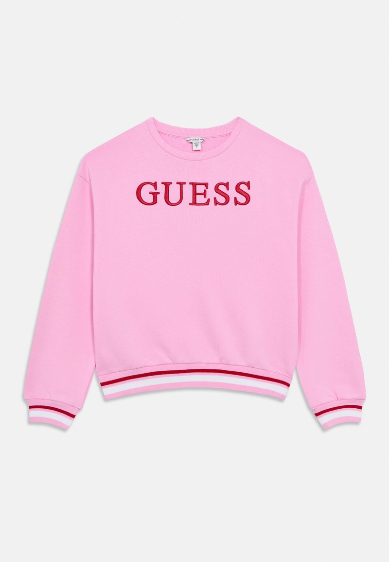 Ροζ φούτερ από βαμβάκι με στρογγυλή λαιμόκοψη. Διακοσμημένο με το λογότυπο «GUESS» κεντημένο με κόκκινη κλωστή και ριγέ μανσέτες και τελείωμα σε κόκκινο και λευκό.