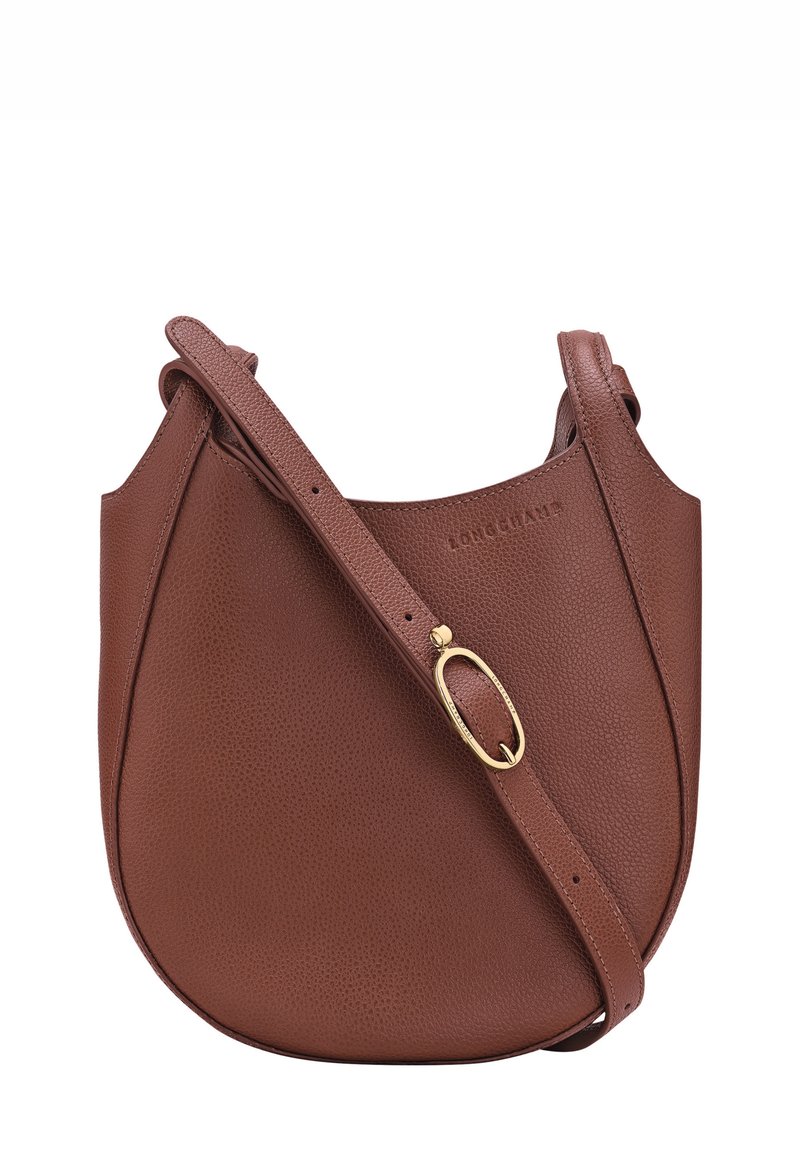 Brown leather shoulder bag with pebbled texture, curved shape, adjustable strap, and gold-tone hardware detail. Logo embossed on front.