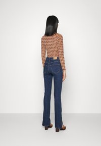 Gina Tricot MOLLY SLIT JEANS - Calças de ganga de corte skinny - rinse