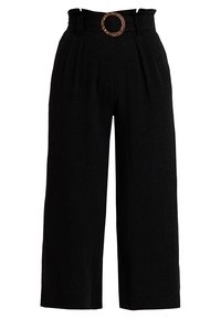 Wide-leg black trousers with pleats, a high waist, and a circular metal belt buckle. Made from a textured fabric. Overall relaxed fit.