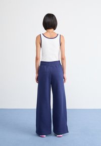 Nike Sportswear PANT - Treniņtērpa apakšdaļas - midnight navy
