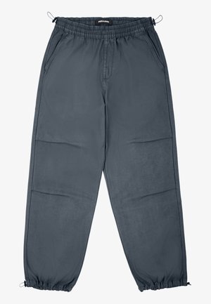 Grå joggerbukser med elastisk talje, sidelommer og elastiske manchetter, der har en glat tekstur og lige snit.