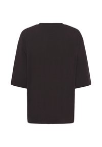 T-shirt noir uni à manches courtes et col rond, vu de dos avec une coupe ample et carrée, sans logos ni motifs visibles.