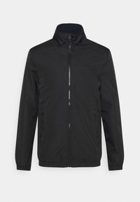 Giubbotto leggero nero, chiusura con zip frontale, colletto alla coreana, due tasche laterali, polsini ed orlo elasticizzati, texture del tessuto liscia, dettagli del logo minimalisti.