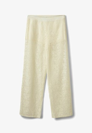 Pantalon en dentelle couleur crème avec une coupe droite, une taille élastique et un motif complexe de dentelle florale sur toute la surface.