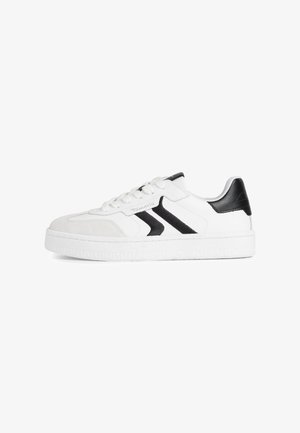 White sneaker with black accents, made of smooth and suede leather, featuring a round toe, lace-up front, and textured rubber outsole.