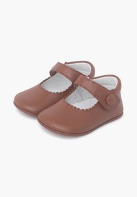 Brown leather Mary Jane shoes with a round toe, scalloped edges, and a side strap with a button closure. Soft inner lining.