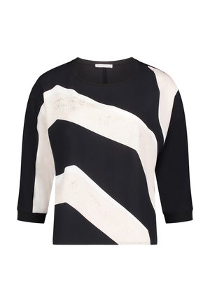 Czarny i kremowy krótki top z długimi rękawami, zdobiony wyraźnymi, zygzakowatymi wzorami i gładką fakturą. Okrągły dekolt z kontrastową lamówką.